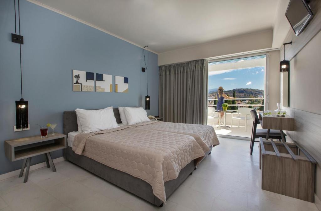 Postel nebo postele na pokoji v ubytování Asteria Hotel
