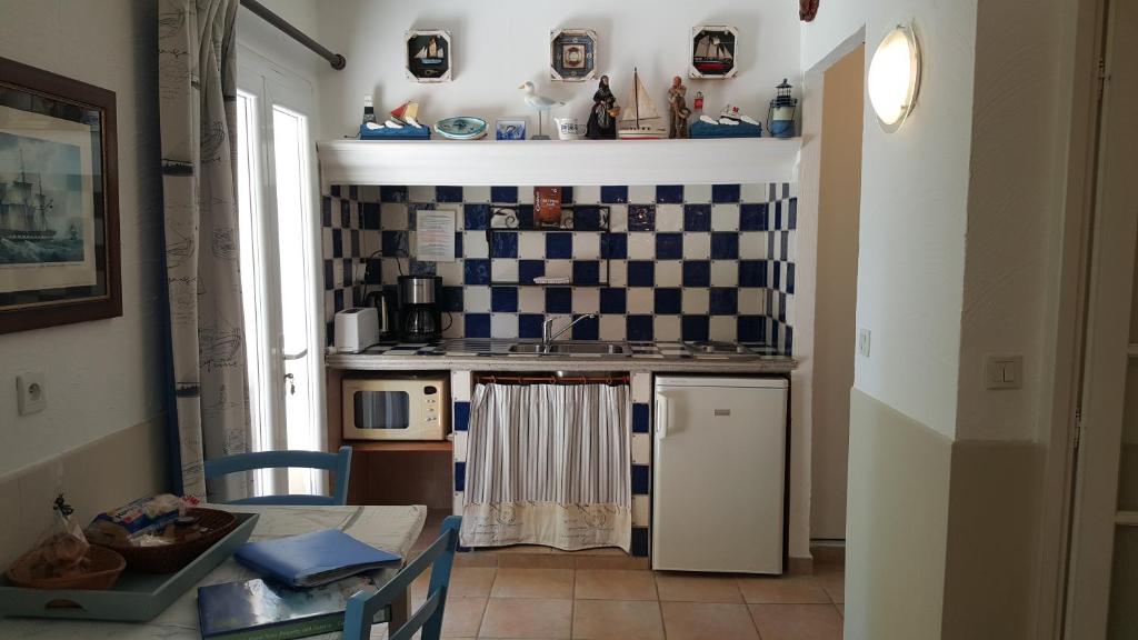 Kuchyň nebo kuchyňský kout v ubytování Résidence Le Home