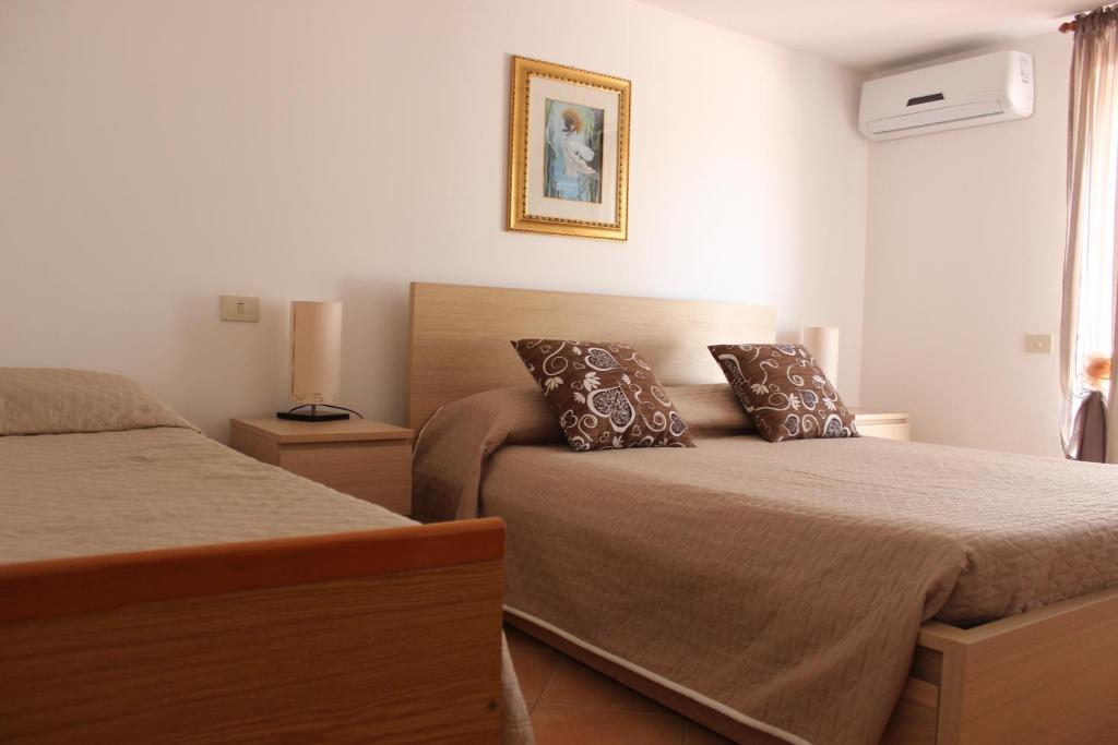 Postel nebo postele na pokoji v ubytování B&B Pizzo Cannicchio