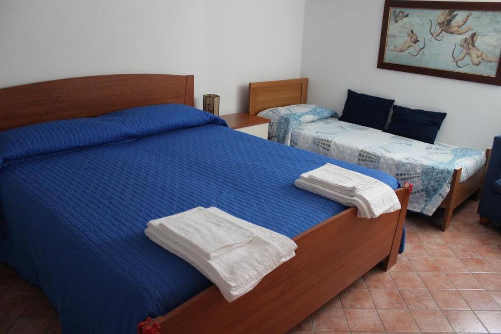 Postel nebo postele na pokoji v ubytování B&B Pizzo Cannicchio