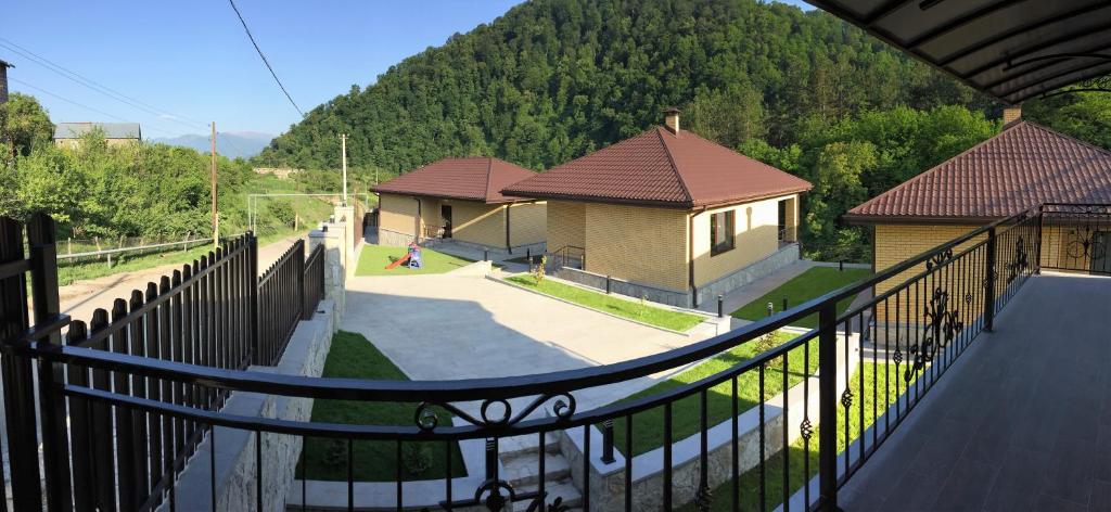 a view from a balcony of a house with a playground at Aurora Villas in Dilijan