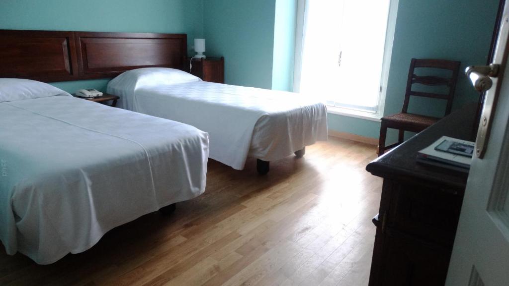 Posteľ alebo postele v izbe v ubytovaní Albergo Bologna