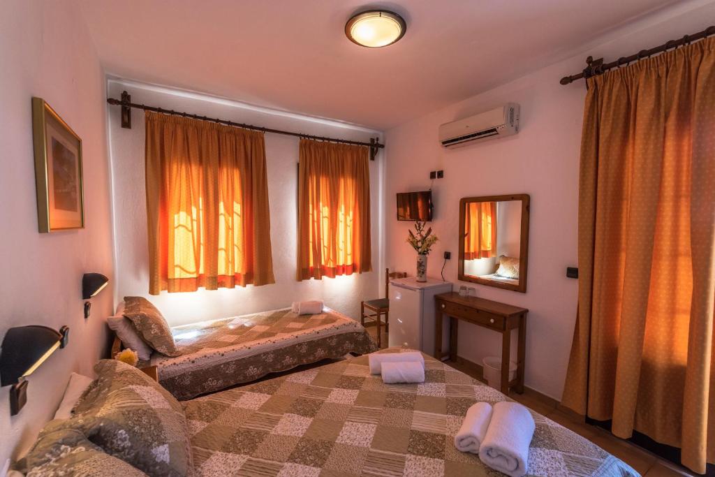 Postel nebo postele na pokoji v ubytování Hotel Sylvia