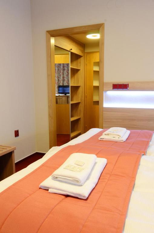 Postel nebo postele na pokoji v ubytování Hotel Uno
