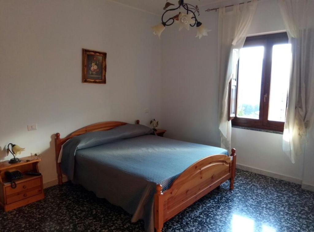 Łóżko lub łóżka w pokoju w obiekcie Casa Vacanze Primula palinuri
