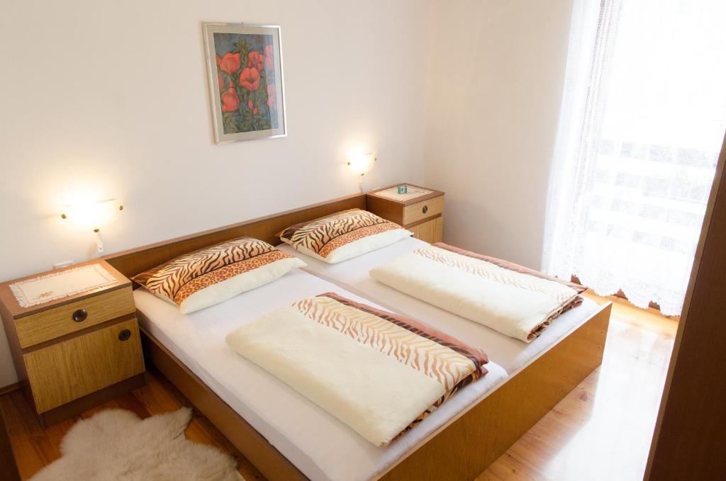 Postel nebo postele na pokoji v ubytování Apartment pri Damijanu