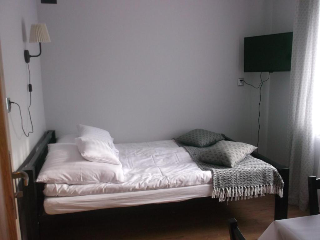 Postel nebo postele na pokoji v ubytování Przy porcie