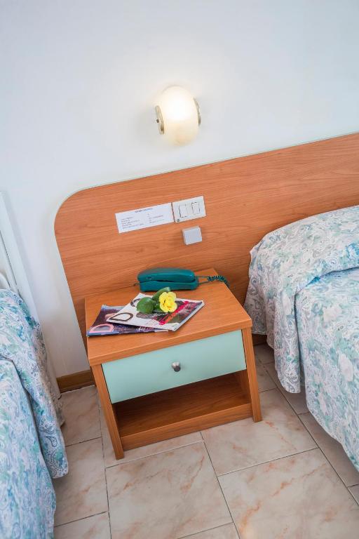 Postel nebo postele na pokoji v ubytování Hotel Darsena