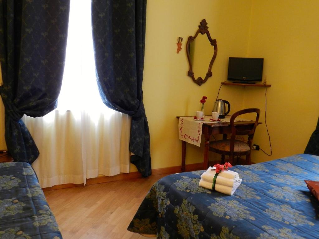 Postel nebo postele na pokoji v ubytování Hotel Ristorante Piccolo Chianti