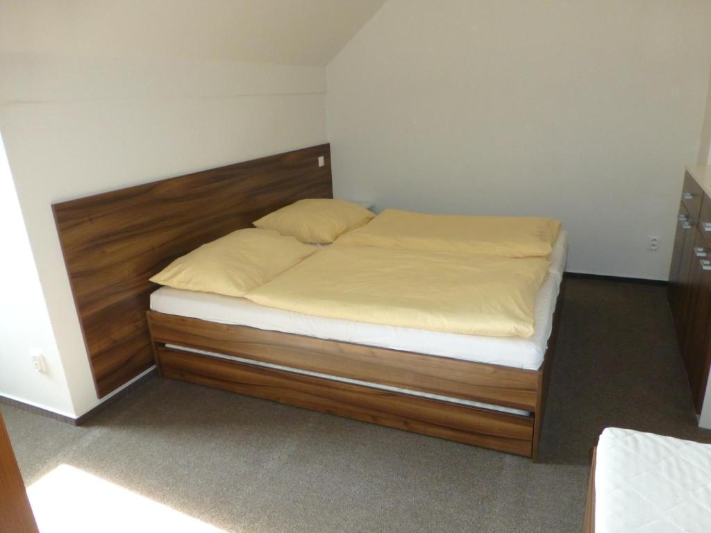 Postel nebo postele na pokoji v ubytování Apartmány Kouty - Jeseníky