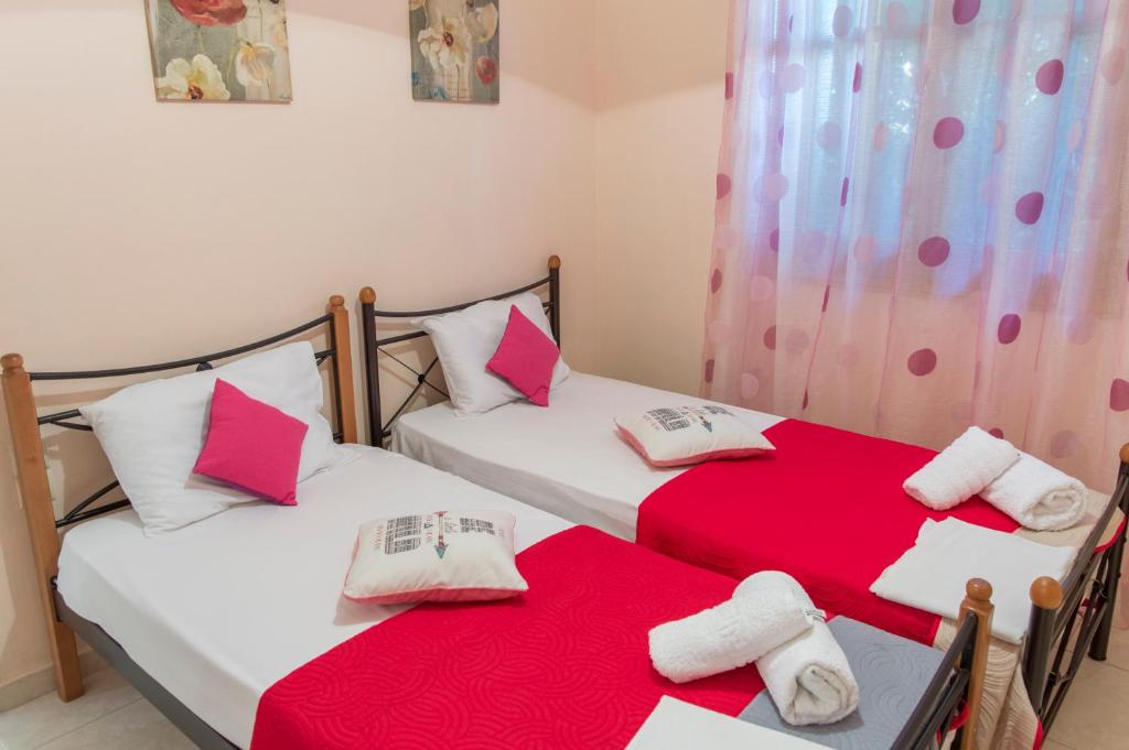 Postel nebo postele na pokoji v ubytování Stavros Apartments