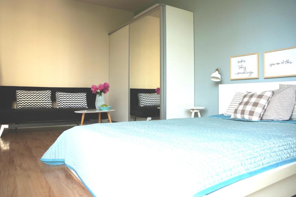 Posteľ alebo postele v izbe v ubytovaní APARTAMENT KOŁOBRZEG