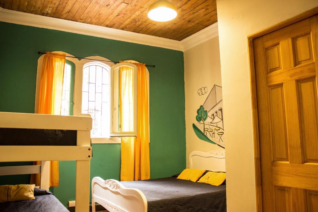 Postel nebo postele na pokoji v ubytování Hostal Forestal