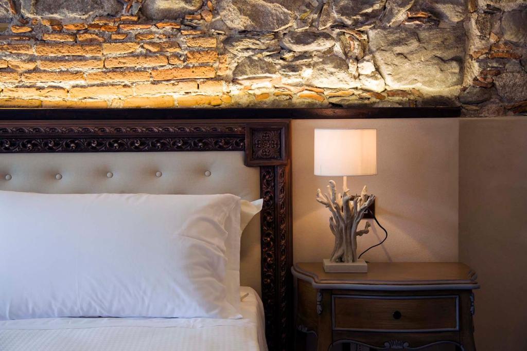 Postel nebo postele na pokoji v ubytování Boutique Hotel Elvezia