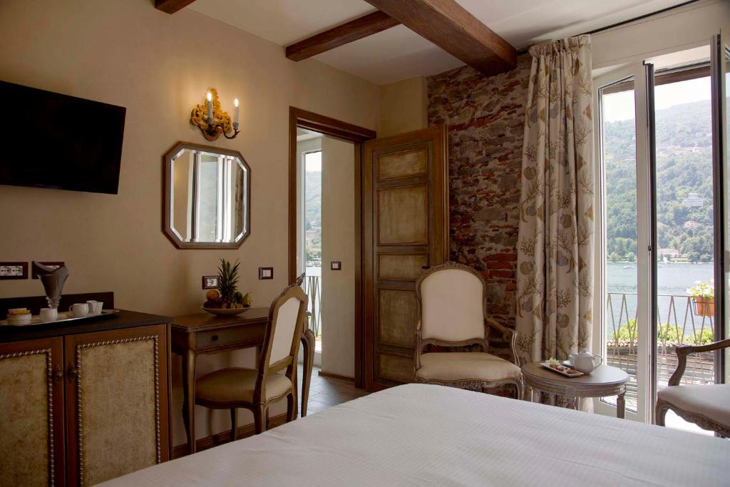 Postel nebo postele na pokoji v ubytování Boutique Hotel Elvezia