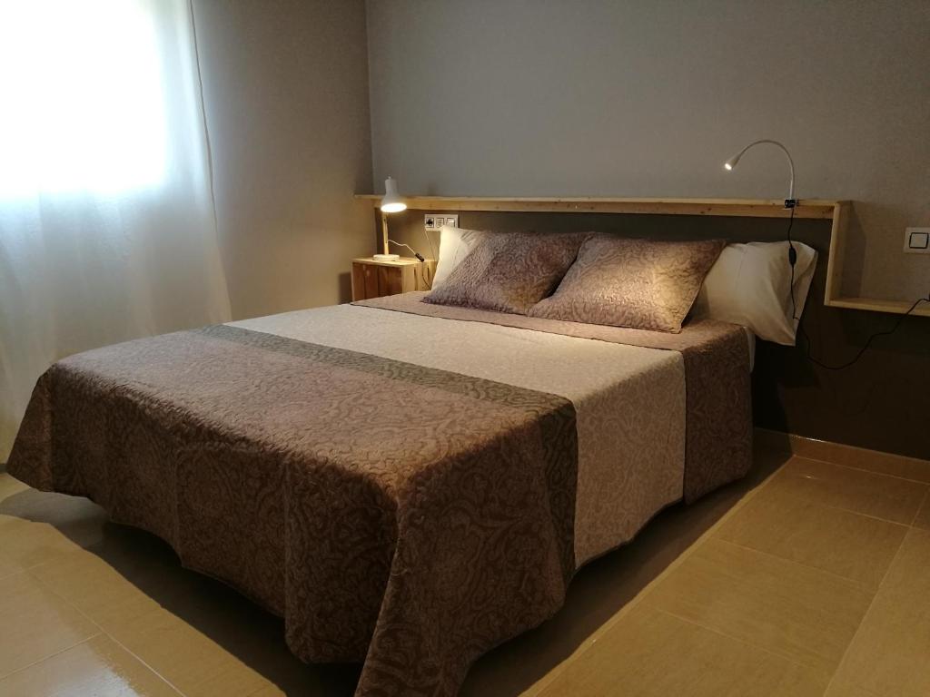 Postel nebo postele na pokoji v ubytování Apartaments Els Temporers