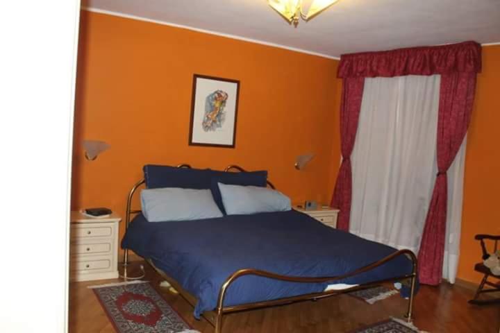A bed or beds in a room at Casa chanoux