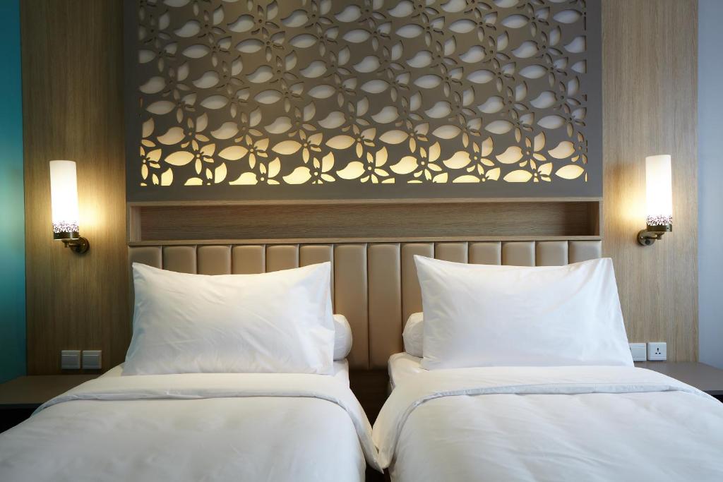 Postel nebo postele na pokoji v ubytování ibis Styles Cikarang