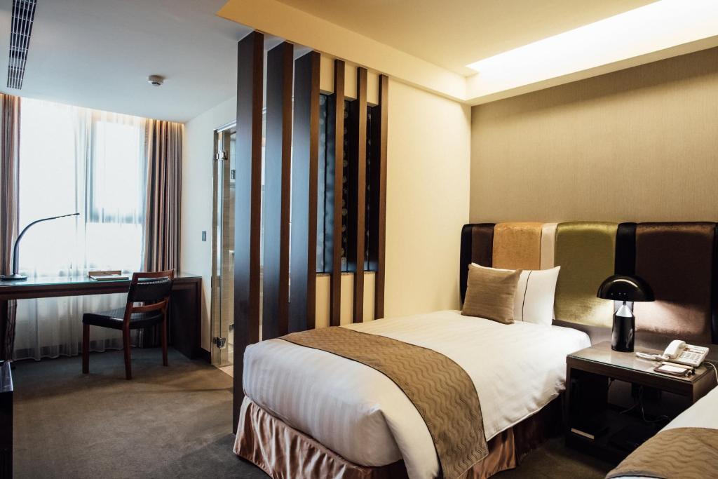 Postel nebo postele na pokoji v ubytování Hotel Sukimi