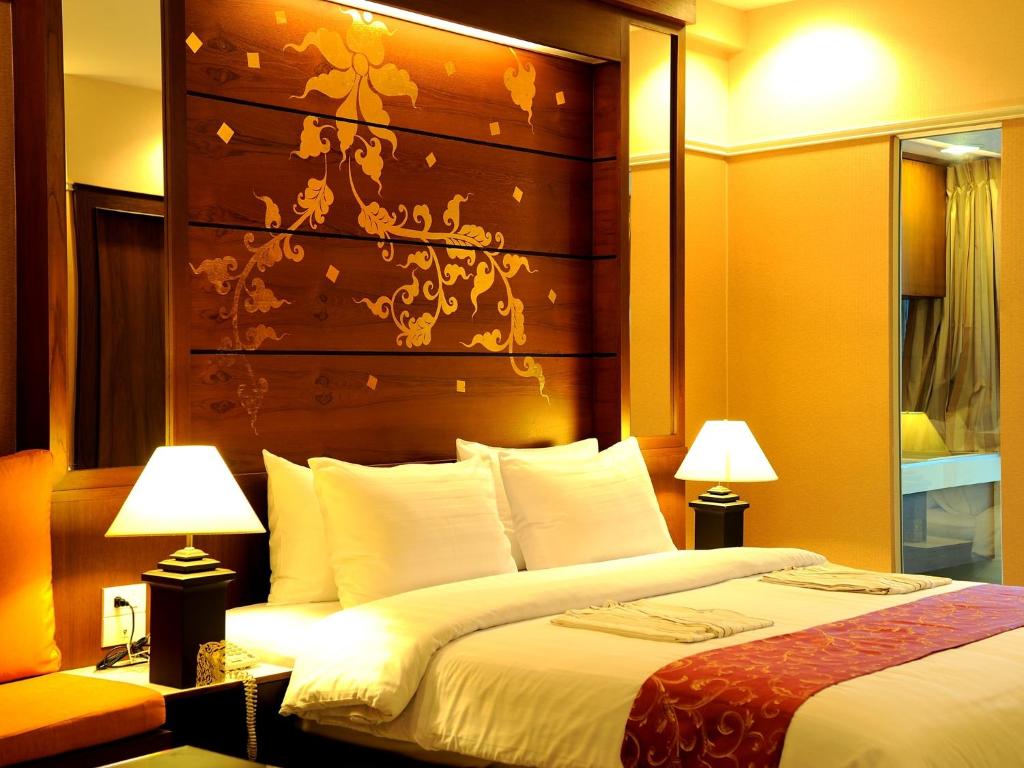 Postel nebo postele na pokoji v ubytování Mariya Boutique Hotel At Suvarnabhumi Airport