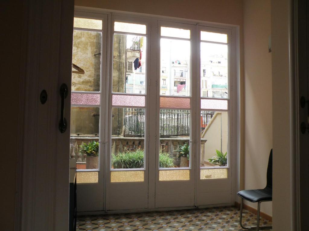 a sliding glass door with a view of a balcony at Center Gran Via in Barcelona