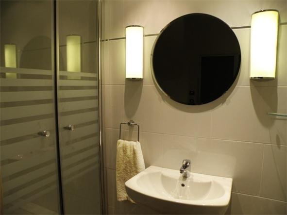 a bathroom with a sink and a mirror at Center Gran Via in Barcelona