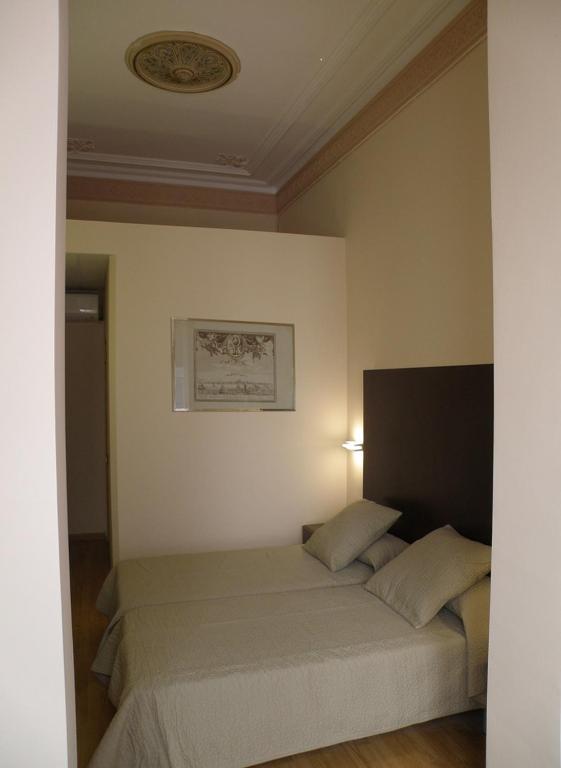a bedroom with a bed in a room at Center Gran Via in Barcelona