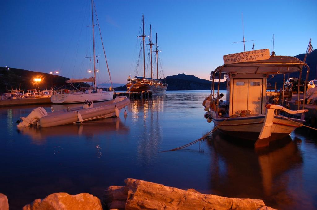a group of boats docked in a harbor at night at Patras Rooms est 1990 in Fourni Ikarias