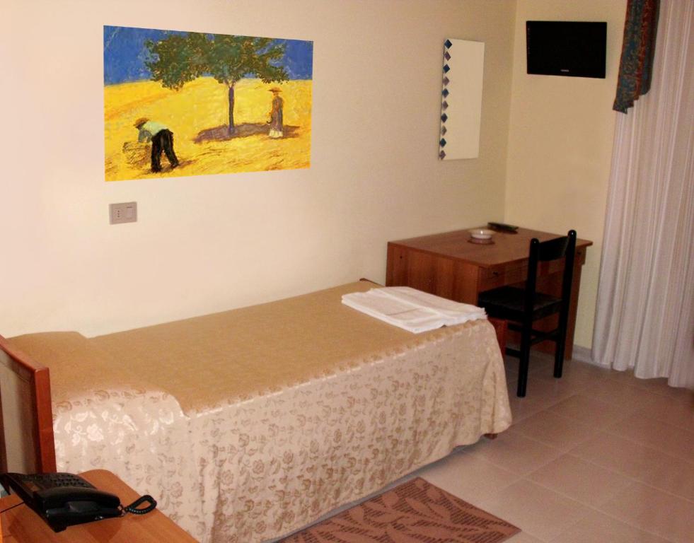 Ένα ή περισσότερα κρεβάτια σε δωμάτιο στο Hotel Ristorante Cordial