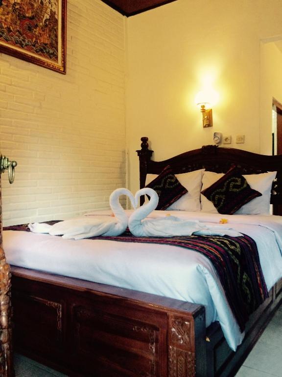 Postel nebo postele na pokoji v ubytování The Jero Ubud