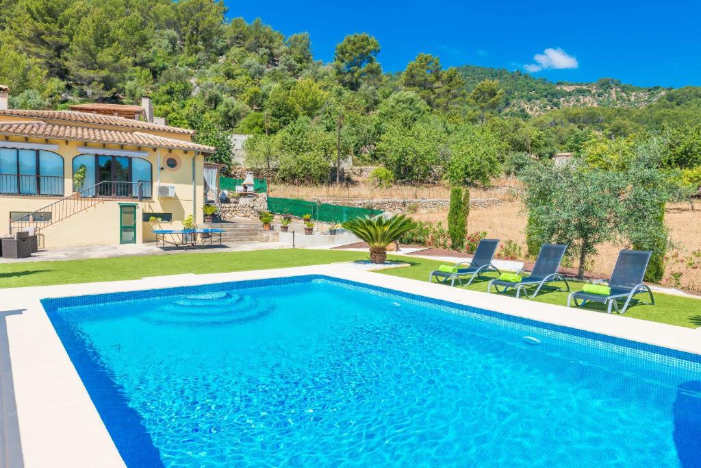 a swimming pool in front of a house at Sa Tanca -Mancorina- in Mancor del Valle