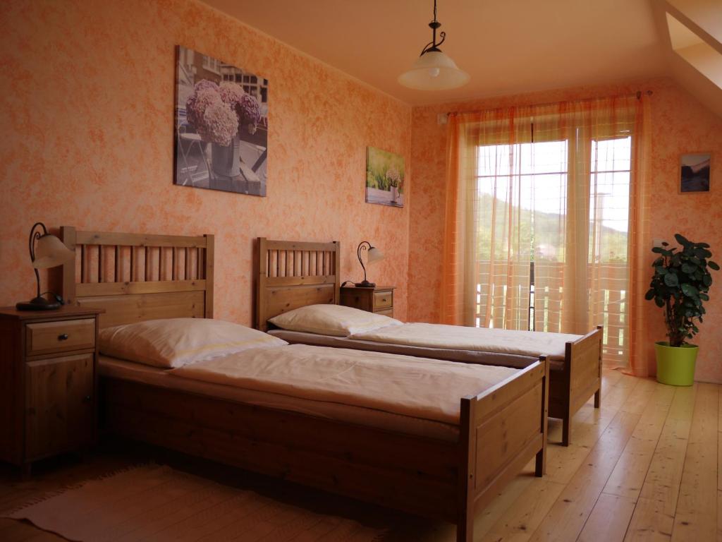 Postel nebo postele na pokoji v ubytování Penzion Pod Hradem