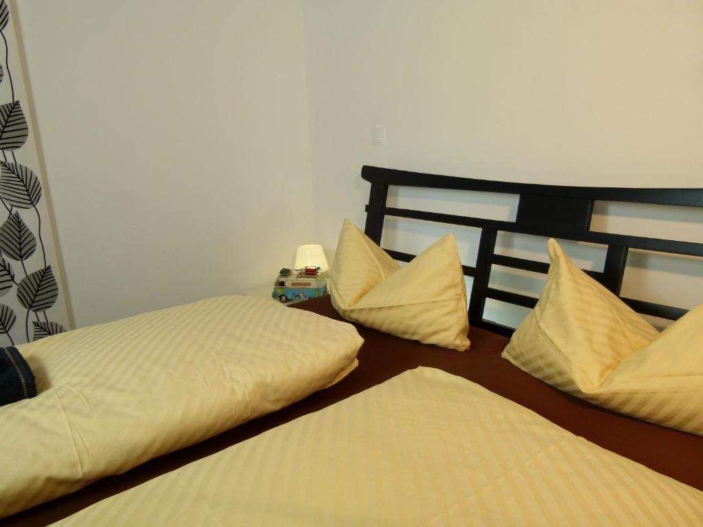 Postel nebo postele na pokoji v ubytování LakeStarnberg Apartments
