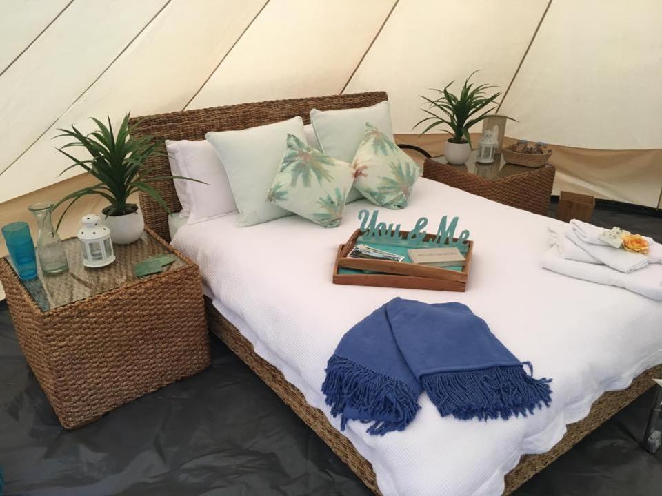 A bed or beds in a room at Glamping Byron Bay