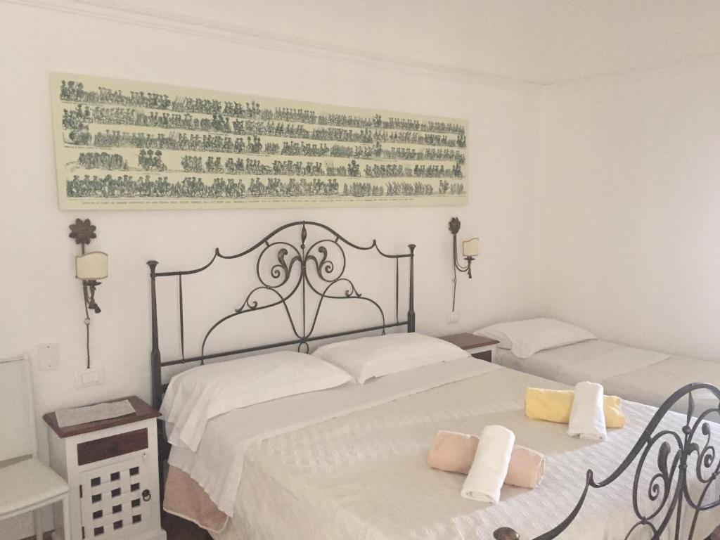 Ένα ή περισσότερα κρεβάτια σε δωμάτιο στο Ballarò Holiday