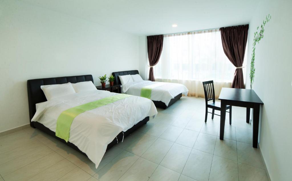 Postel nebo postele na pokoji v ubytování Hard Rock VIP Guest House