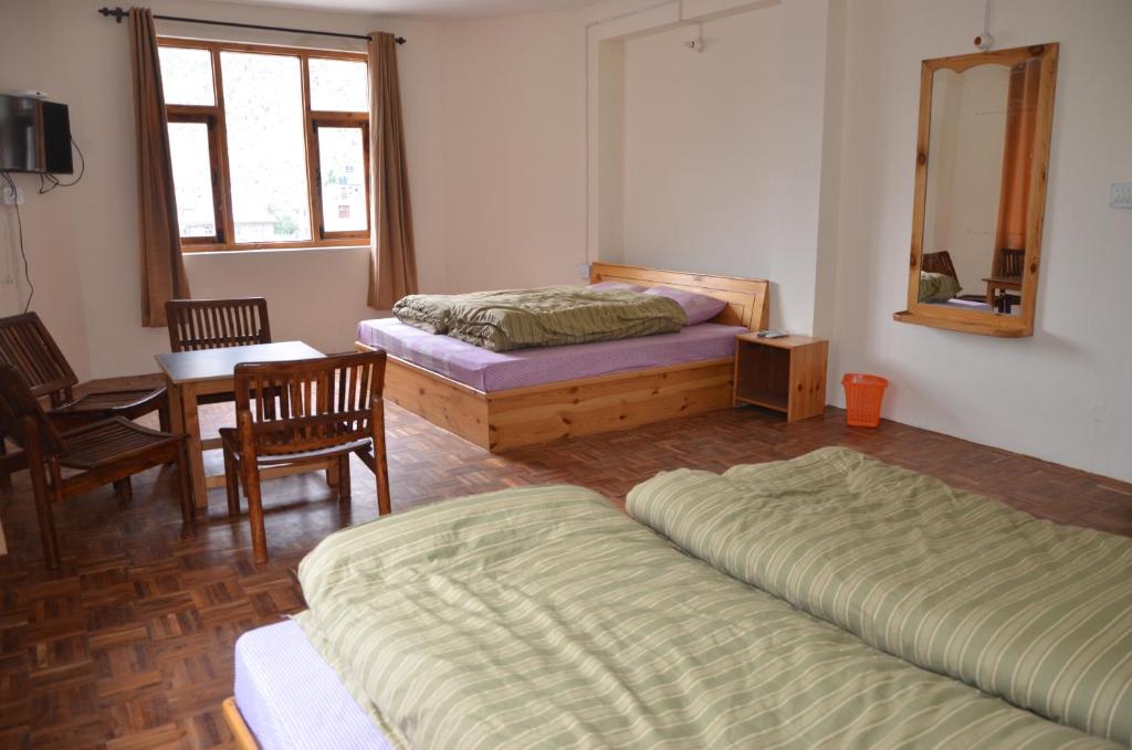 Postel nebo postele na pokoji v ubytování Hotel Yak Jispa
