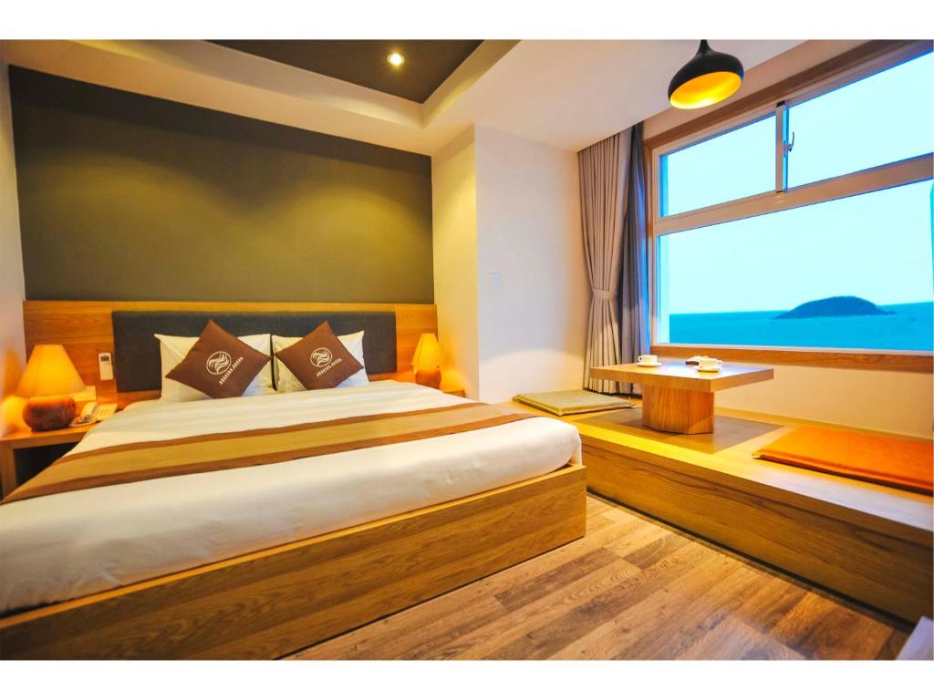 Postel nebo postele na pokoji v ubytování Seasing Boutique Hotel