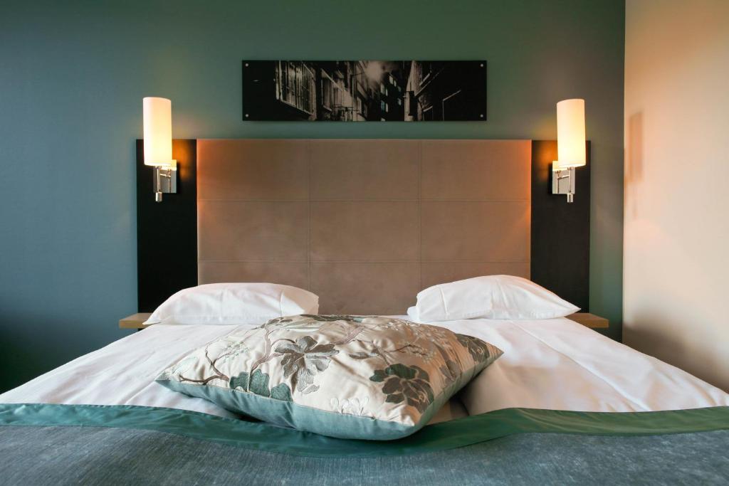 Postel nebo postele na pokoji v ubytování Quality Hotel Augustin