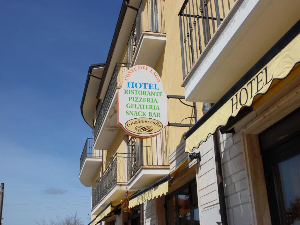 a hotel sign on the side of a building at Hotel Coste Del Lago in Limosano