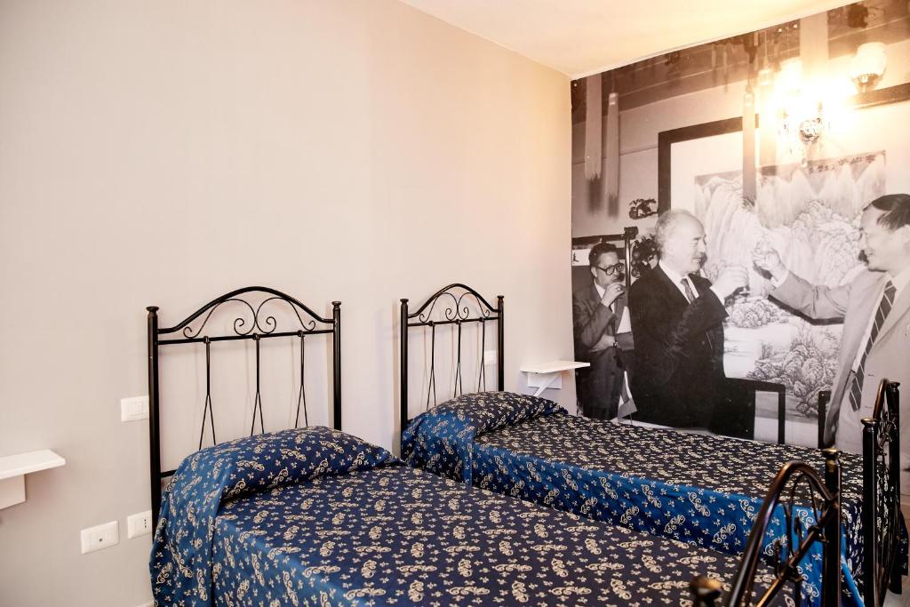 Postel nebo postele na pokoji v ubytování Hotel Ospite Inatteso
