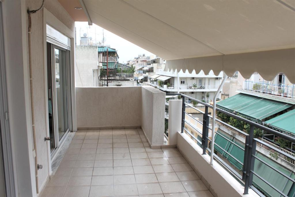 an apartment balcony with a view of a city at Functional Studio in Sepolia Athens in Athens