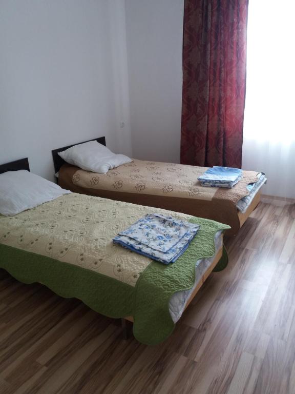 Postel nebo postele na pokoji v ubytování Guest House Arbat