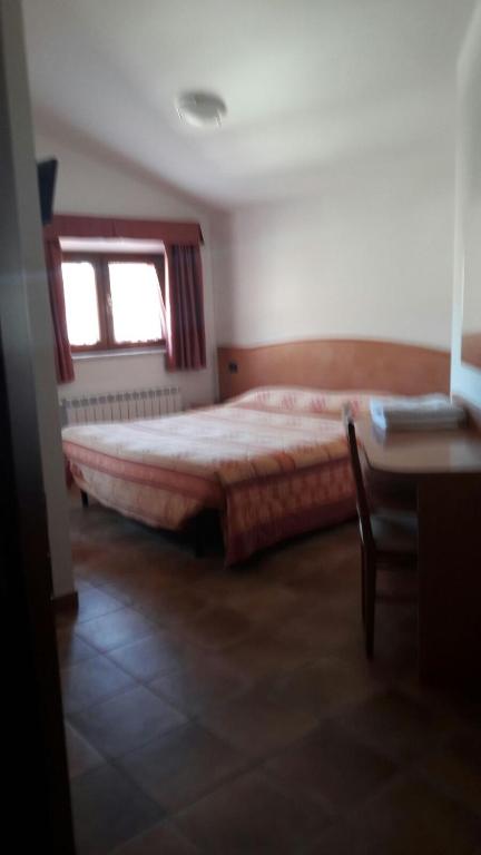 Postel nebo postele na pokoji v ubytování Affittacamere L'Airone