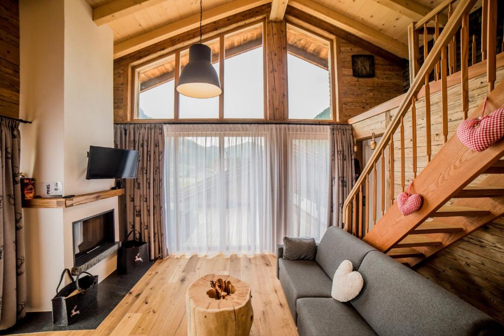 TV a/nebo společenská místnost v ubytování Braito's Seaside Lodges und Suites