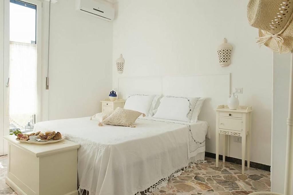 Postel nebo postele na pokoji v ubytování Dimora Cappuccini Guest House