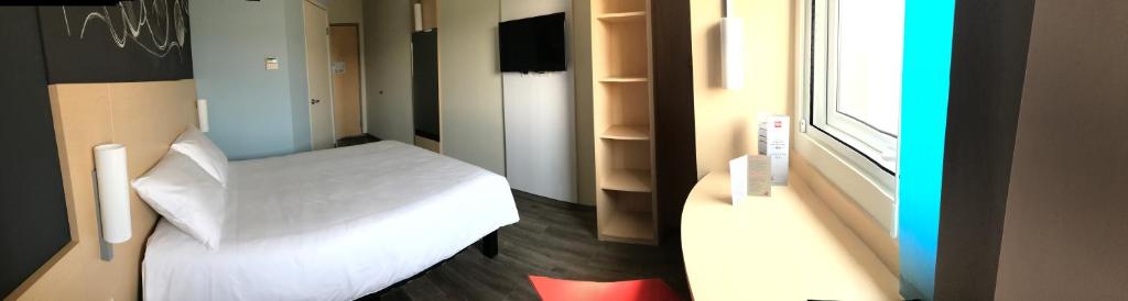 Postel nebo postele na pokoji v ubytování Ibis Irapuato