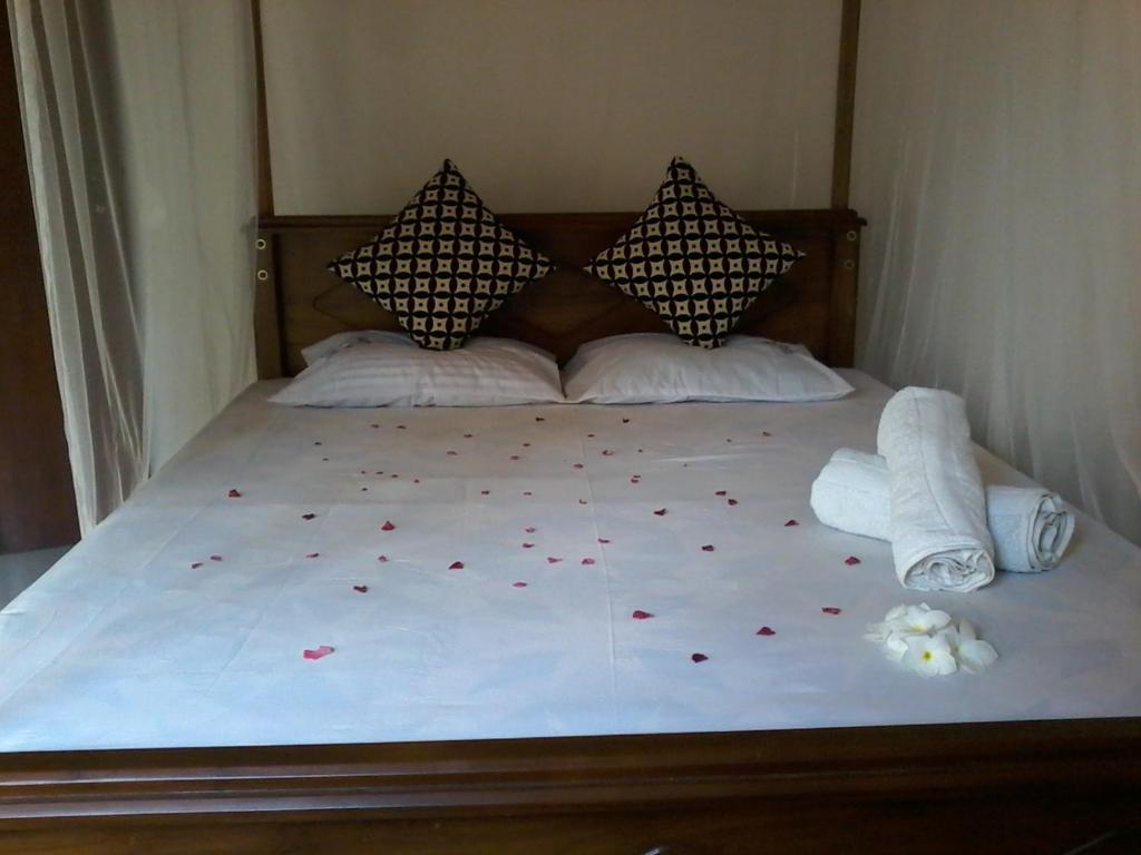 Postel nebo postele na pokoji v ubytování Ameena Homestay