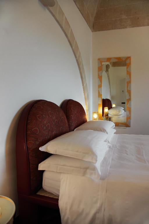 Postel nebo postele na pokoji v ubytování Antica Civita Luxury Room