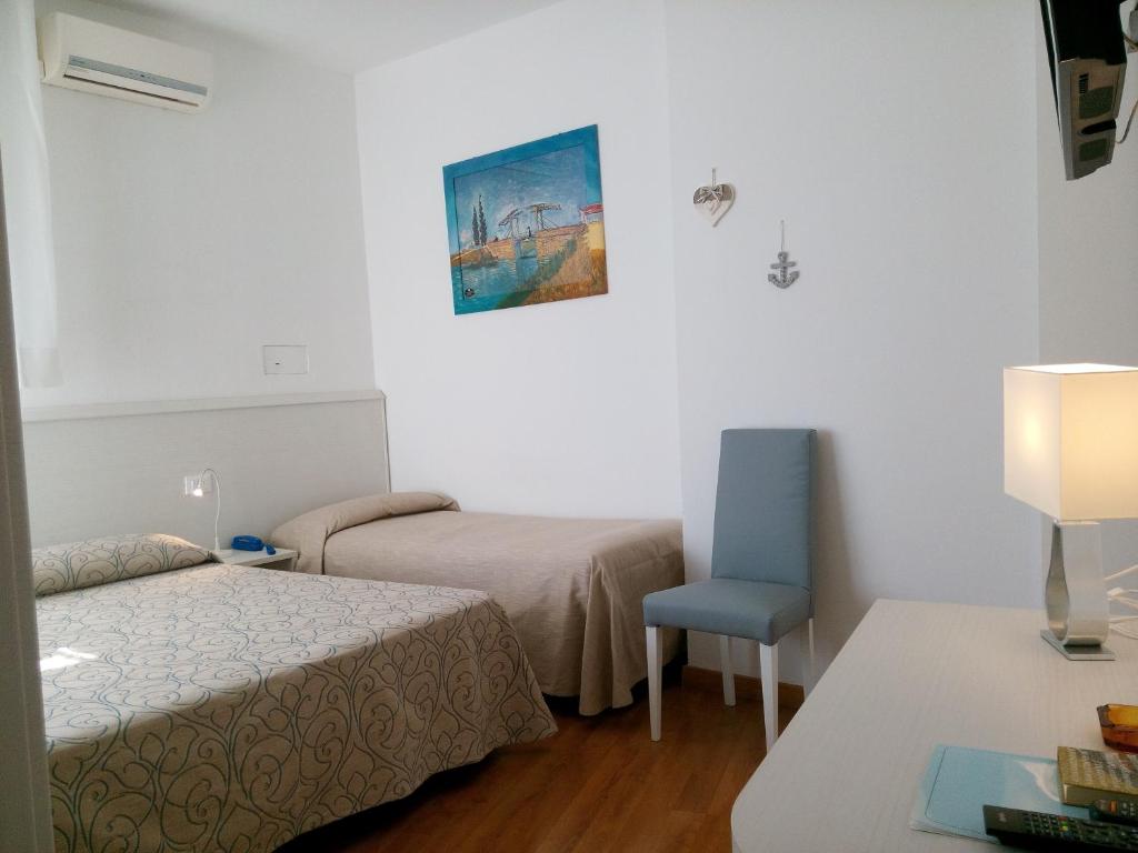 Postel nebo postele na pokoji v ubytování Hotel Telenia